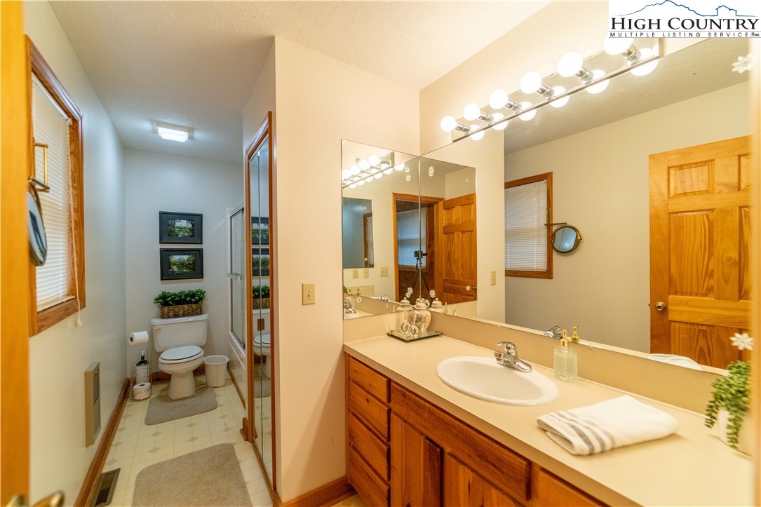 2161 River Bend Road Mouth Of Wilson, VA 24363 - Photo 25 of 47 a spacious bathroom with a sink double vanity and a mirror