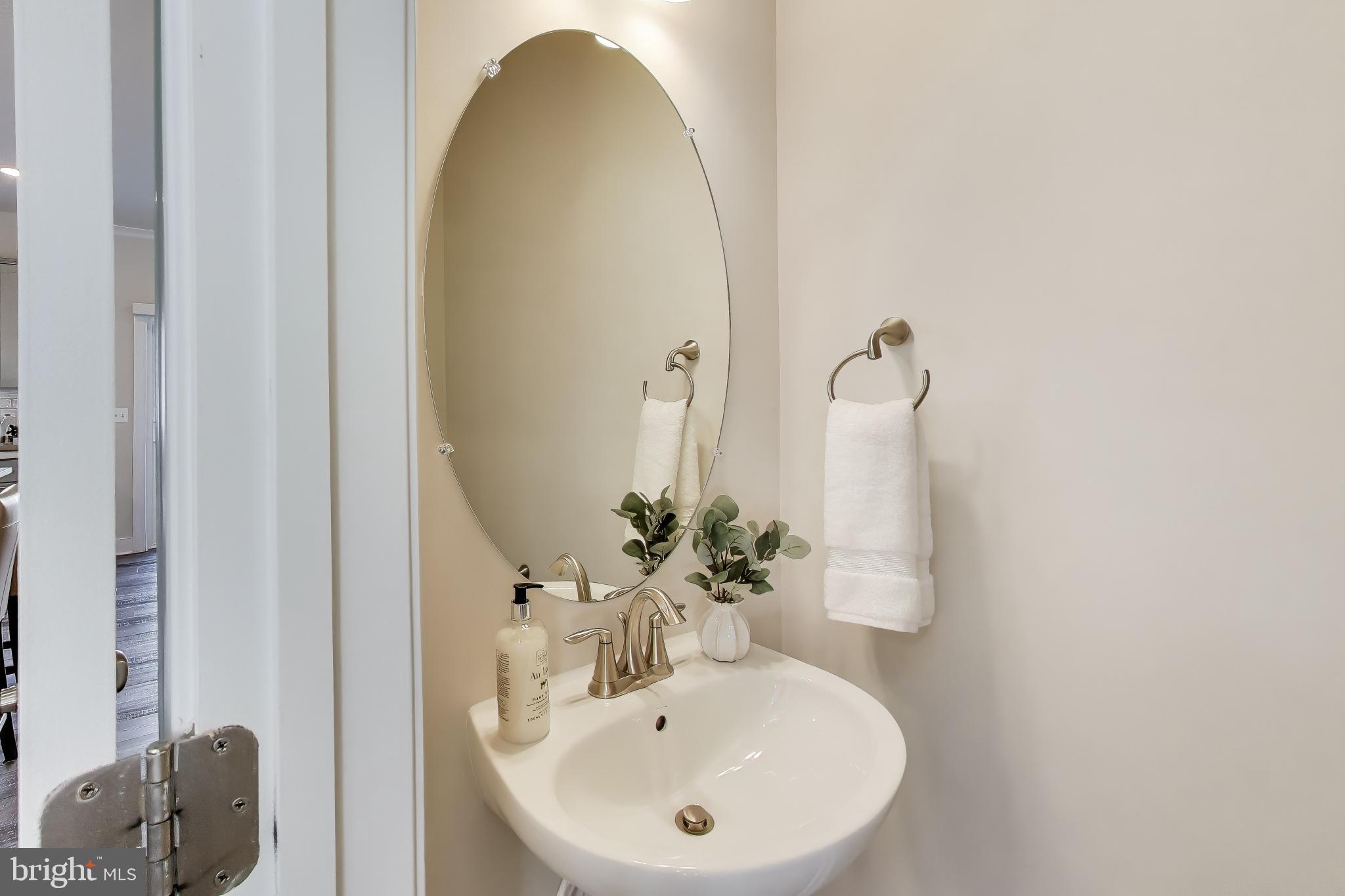 111 Armstrong Place Gaithersburg, MD 20878 - Photo 13 of 50 a bathroom with a sink and a mirror