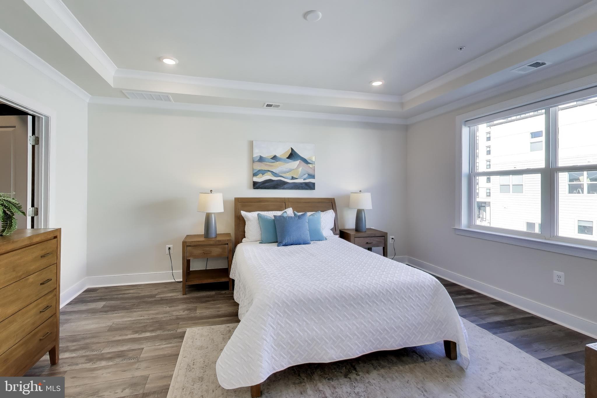 111 Armstrong Place Gaithersburg, MD 20878 - Photo 15 of 50 a bedroom with a bed and a dresser