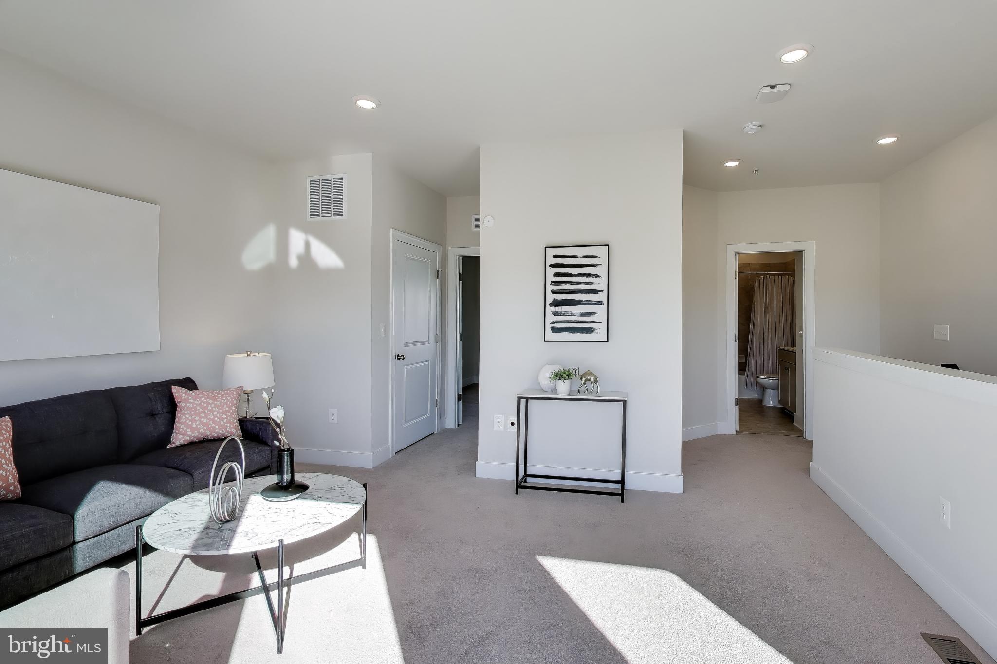 111 Armstrong Place Gaithersburg, MD 20878 - Photo 26 of 50 a living room with furniture and a wooden floor