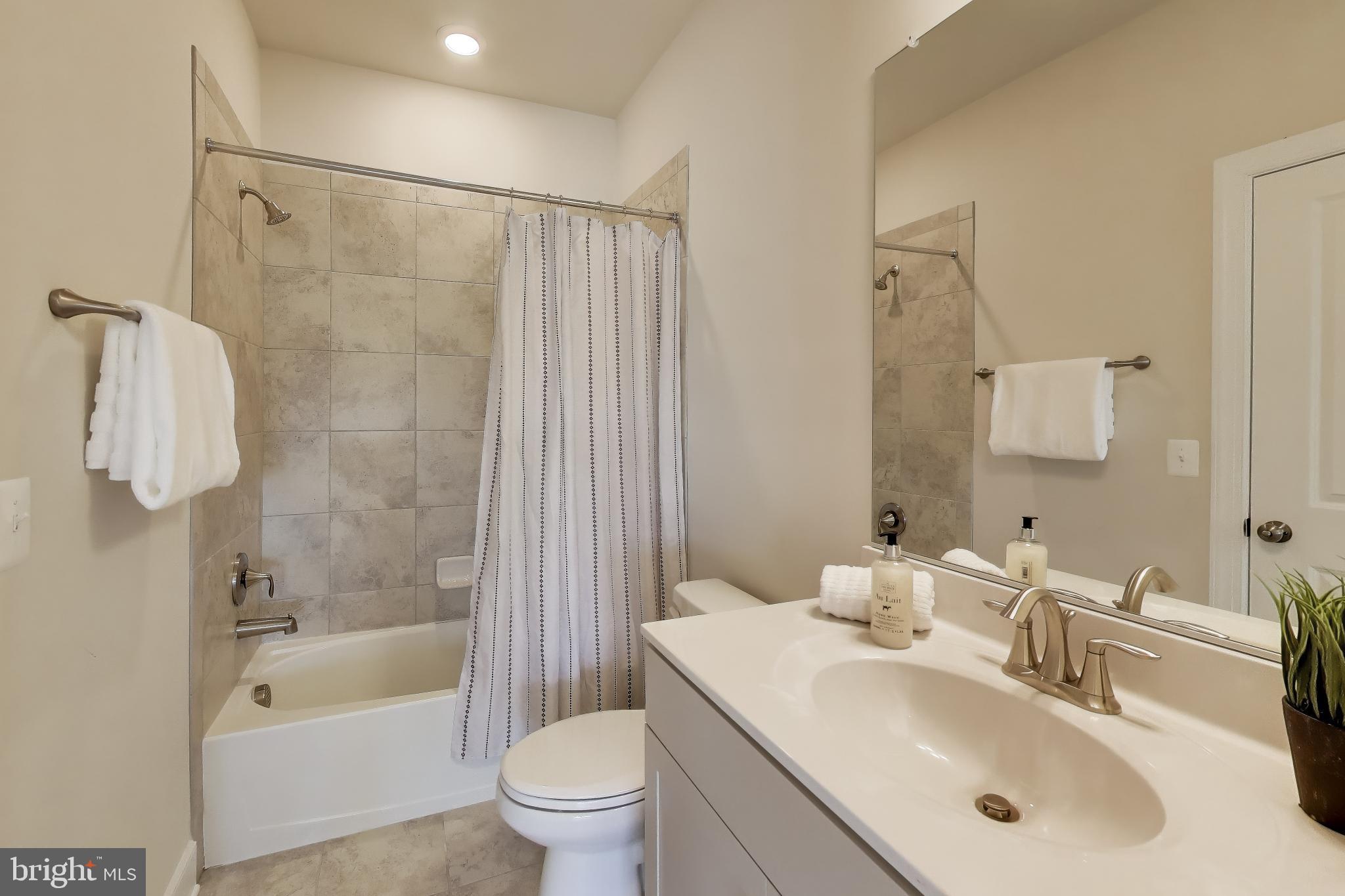 111 Armstrong Place Gaithersburg, MD 20878 - Photo 31 of 50 a bathroom with a sink toilet and shower