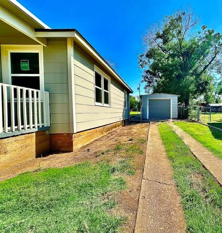 a house view with a backyard space
