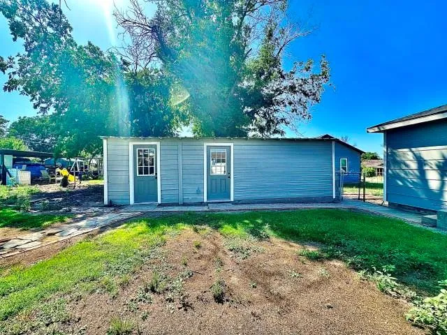 a view of a back yard with a house