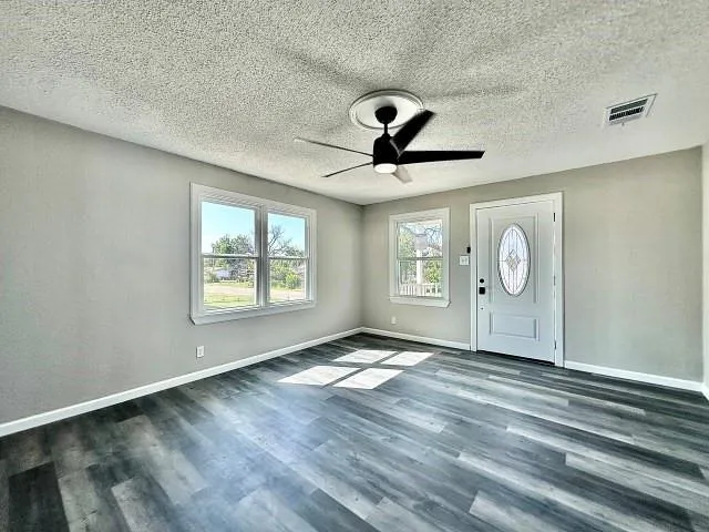 a view of an empty room and window
