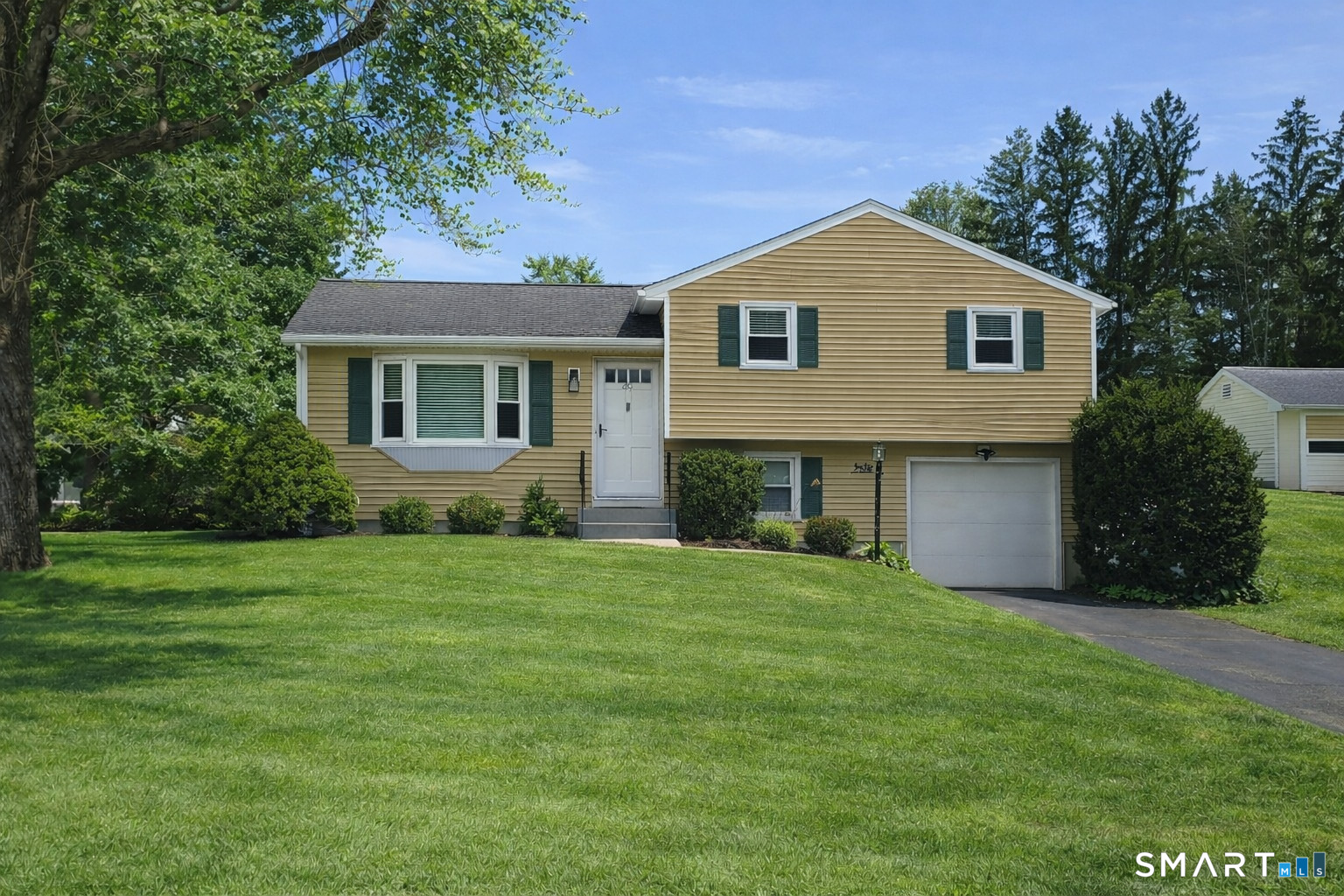49 Lancaster Road Glastonbury, CT 06033 - Photo 1 of 1 a front view of house with yard and green space