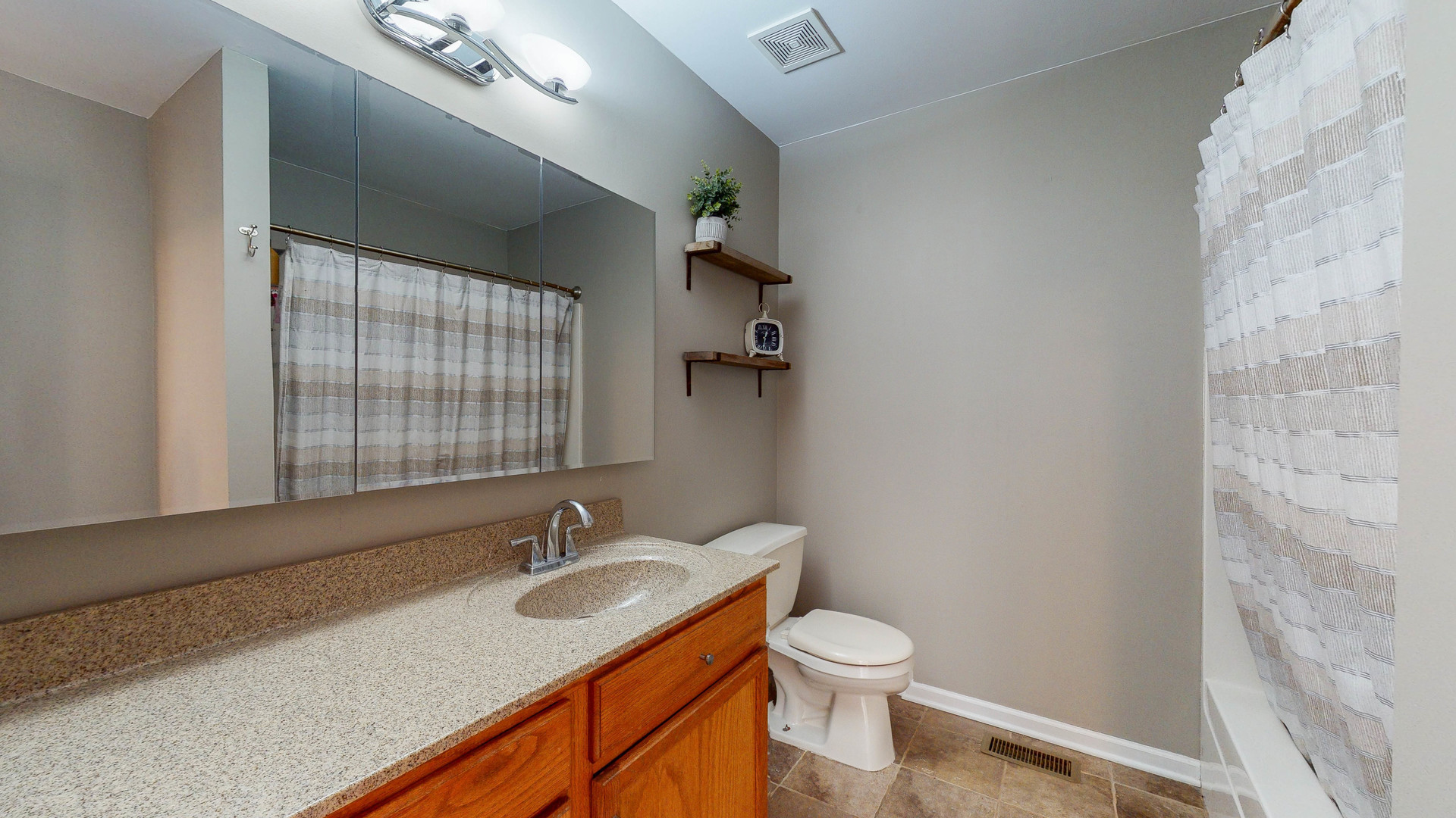 16031 Golf View Drive Lockport, IL 60441 - Photo 15 of 23 a bathroom with a granite countertop sink toilet and a mirror