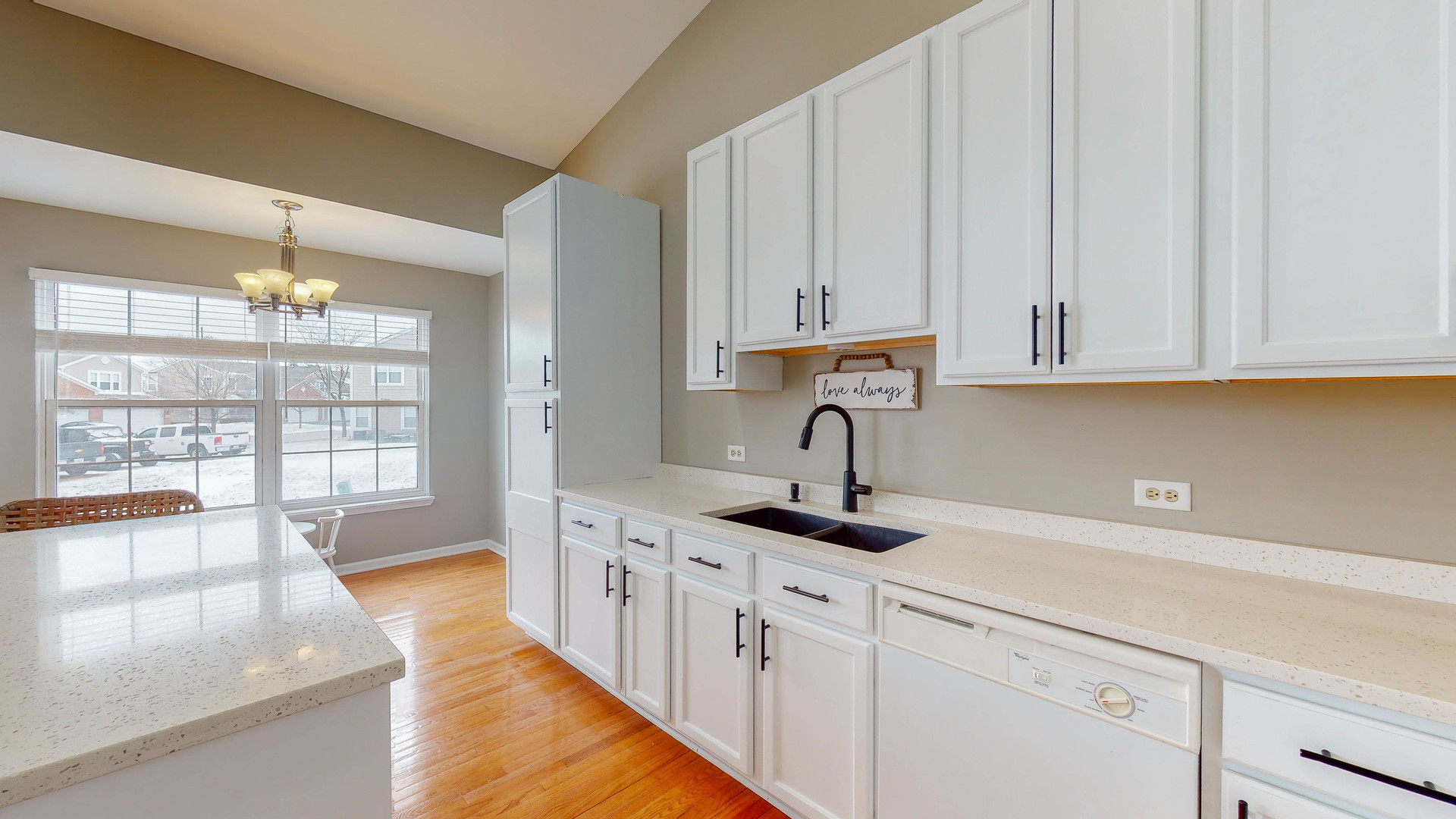 16031 Golf View Drive Lockport, IL 60441 - Photo 7 of 23 a kitchen with stainless steel appliances granite countertop a sink dishwasher and white cabinets with wooden floor
