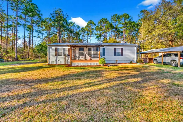 a swimming pool with outdoor seating and yard