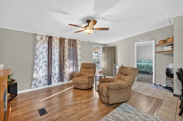 a kitchen with cabinets and chairs