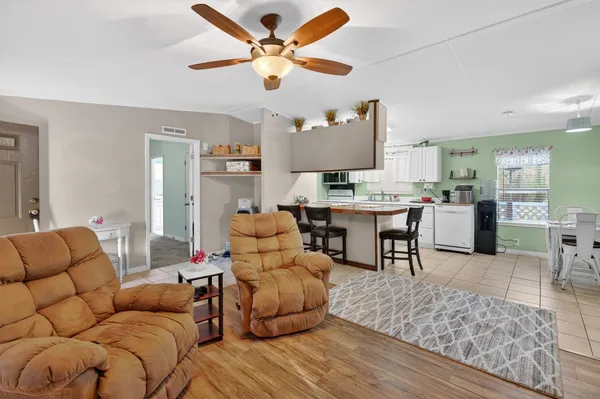 a bathroom with a toilet and a shower curtain
