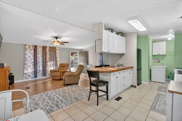 a view of a bathroom from a corridor