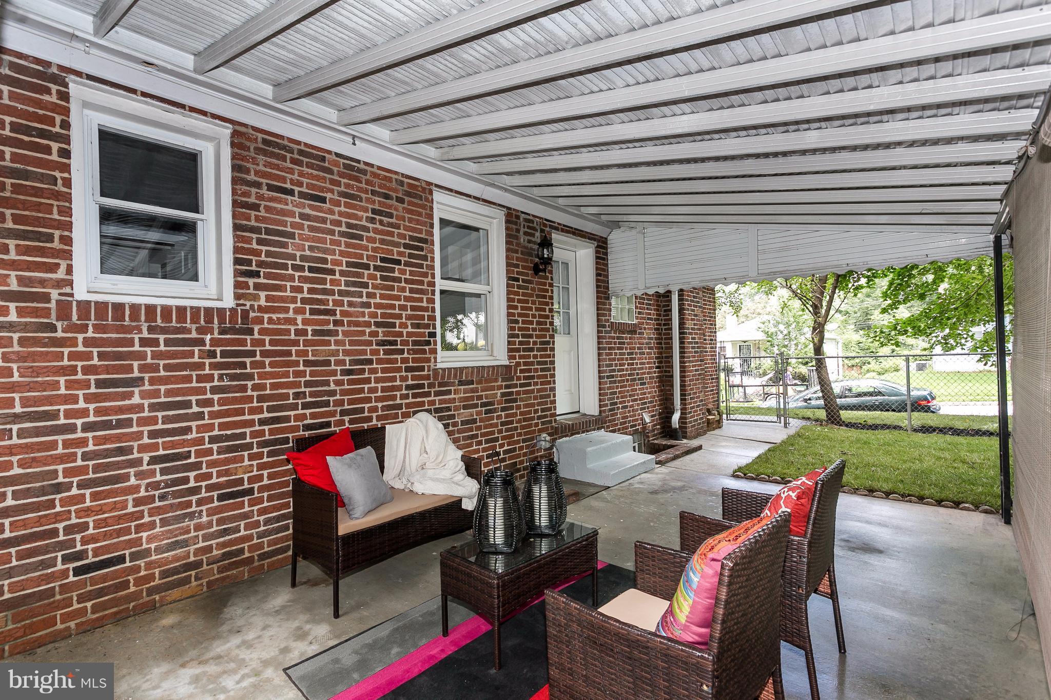 3203 Cedarhurst Road Baltimore, MD 21214 - Photo 22 of 29 a building outdoor space with patio furniture