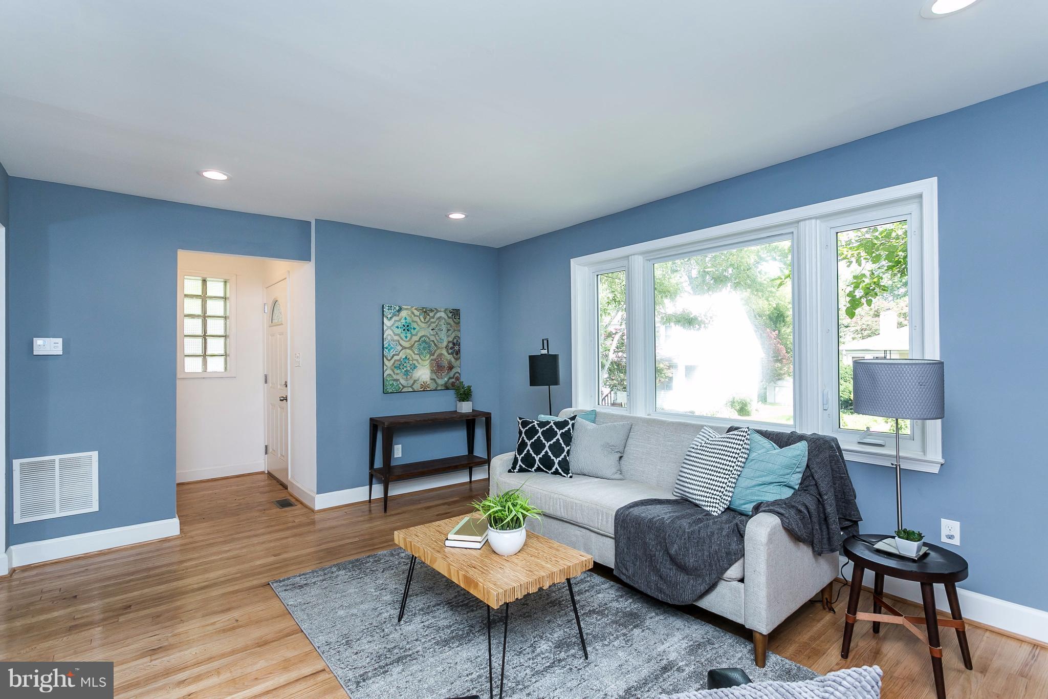 3203 Cedarhurst Road Baltimore, MD 21214 - Photo 5 of 29 a living room with furniture and a wooden floor