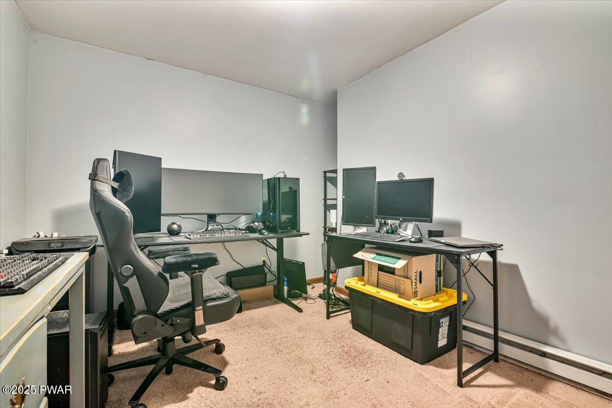 192 Heather Hill Road Dingmans Ferry, PA 18328 - Photo 40 of 74 a view of a workspace with furniture and a window