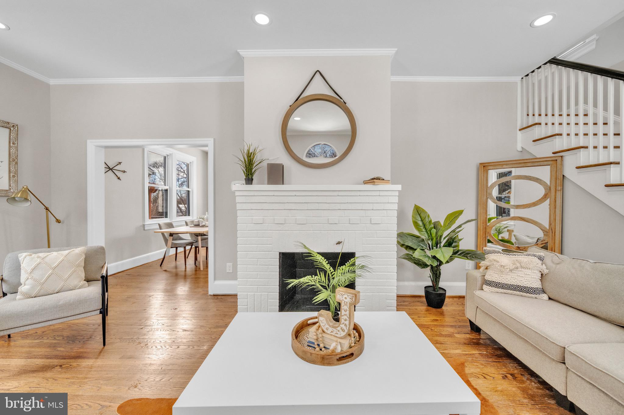 6018 2nd Street Northwest Washington, DC 20011 - Photo 2 of 18 a living room with furniture a fireplace and potted plants