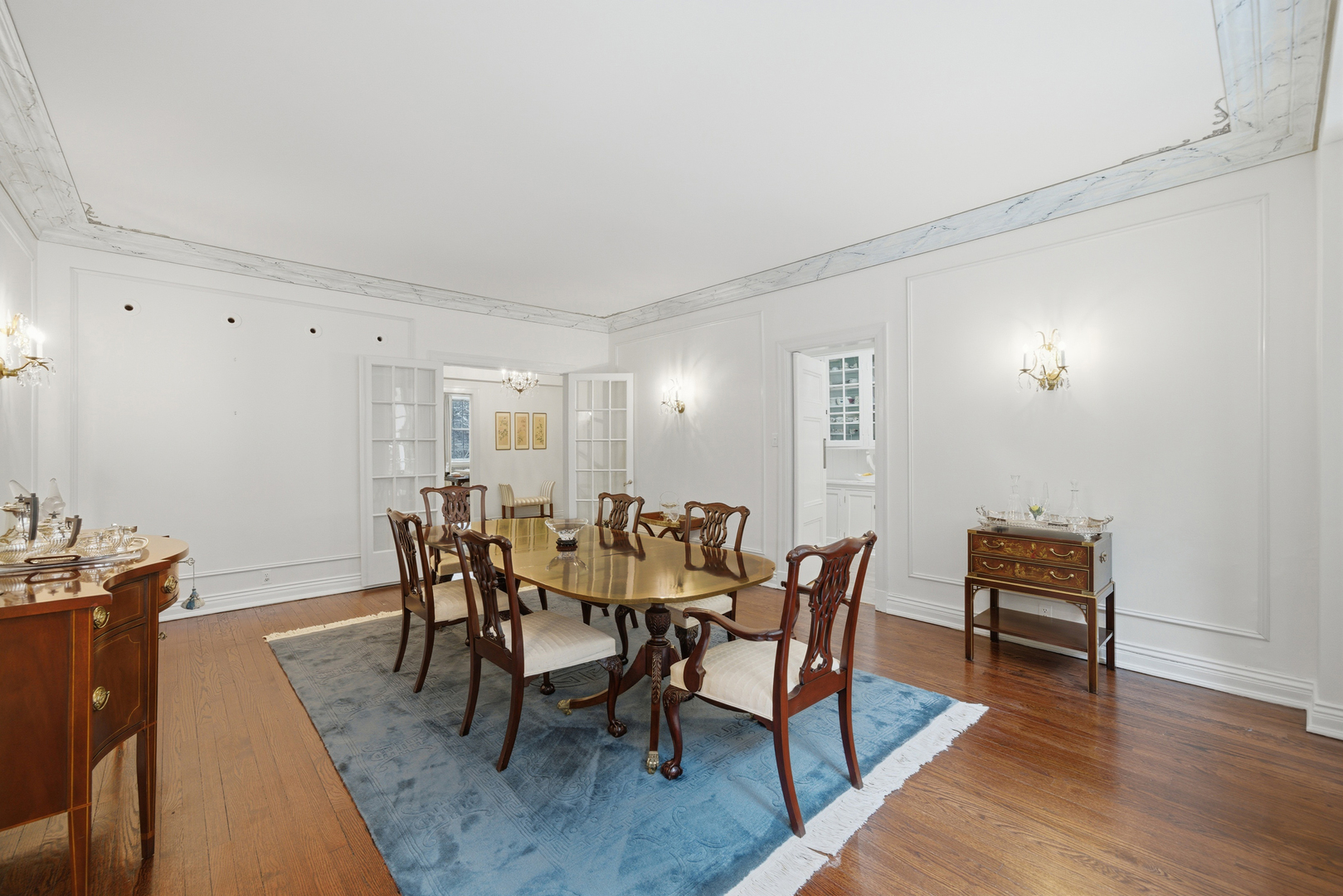 232 East Walton Place, Unit 3E Chicago, IL 60611 - Photo 11 of 36 a view of a dining room with furniture and wooden floor