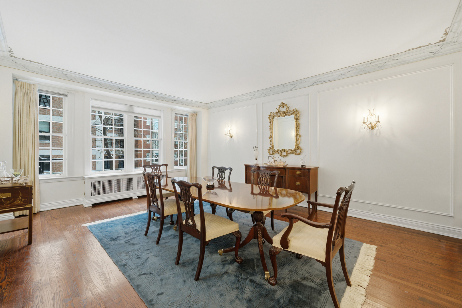 232 East Walton Place, Unit 3E Chicago, IL 60611 - Photo 9 of 36 a view of a dining room with furniture and wooden floor