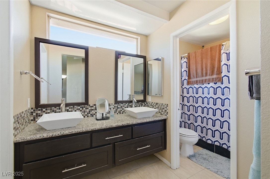 8623 Tiverton Road Las Vegas, NV 89123 - Photo 11 of 18 PRIMARY BATH WITH CUSTOM DOUBLE SINKS, CUSTOM BACKSPLASH TUB/SHOWER COMBINATION