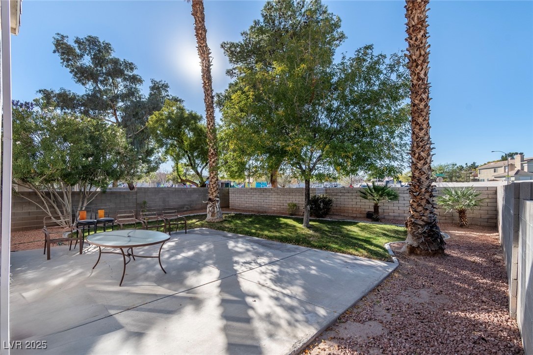 8623 Tiverton Road Las Vegas, NV 89123 - Photo 15 of 18 OVERSIZED PATIO WITH LARGE PATIO FOR ENTERTAINING