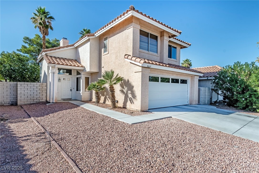 8623 Tiverton Road Las Vegas, NV 89123 - Photo 2 of 18 2 CAR ATTACHED GARAGE WITH ENTRY INTO HOUSE. EASY CAR DESERT LANDSCAPING