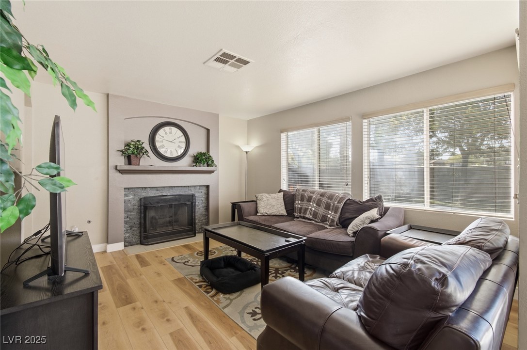 8623 Tiverton Road Las Vegas, NV 89123 - Photo 7 of 18 SEPARATE FAMILY ROOM OFF OF KITCHEN WITH COZY GAS FIREPLACE