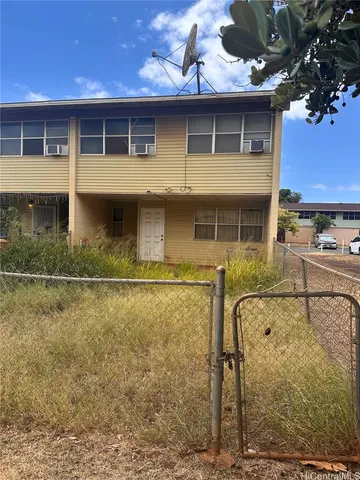 a front view of a house with parking walls