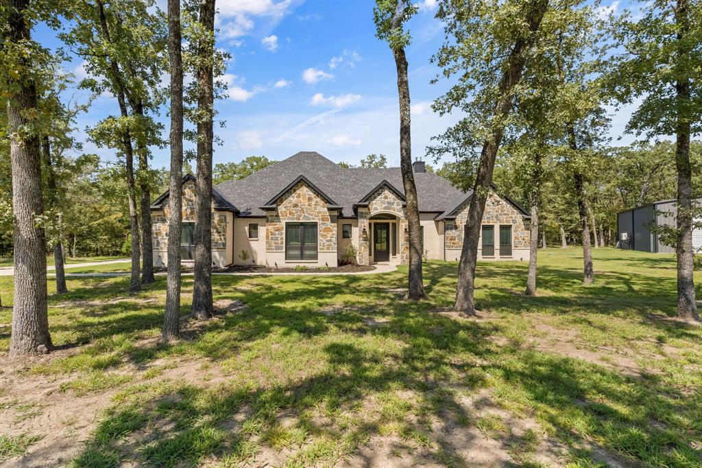 6707 Anchor Quinlan, TX 75474 - Photo 2 of 40 Front of home with ample yard and tall mature trees