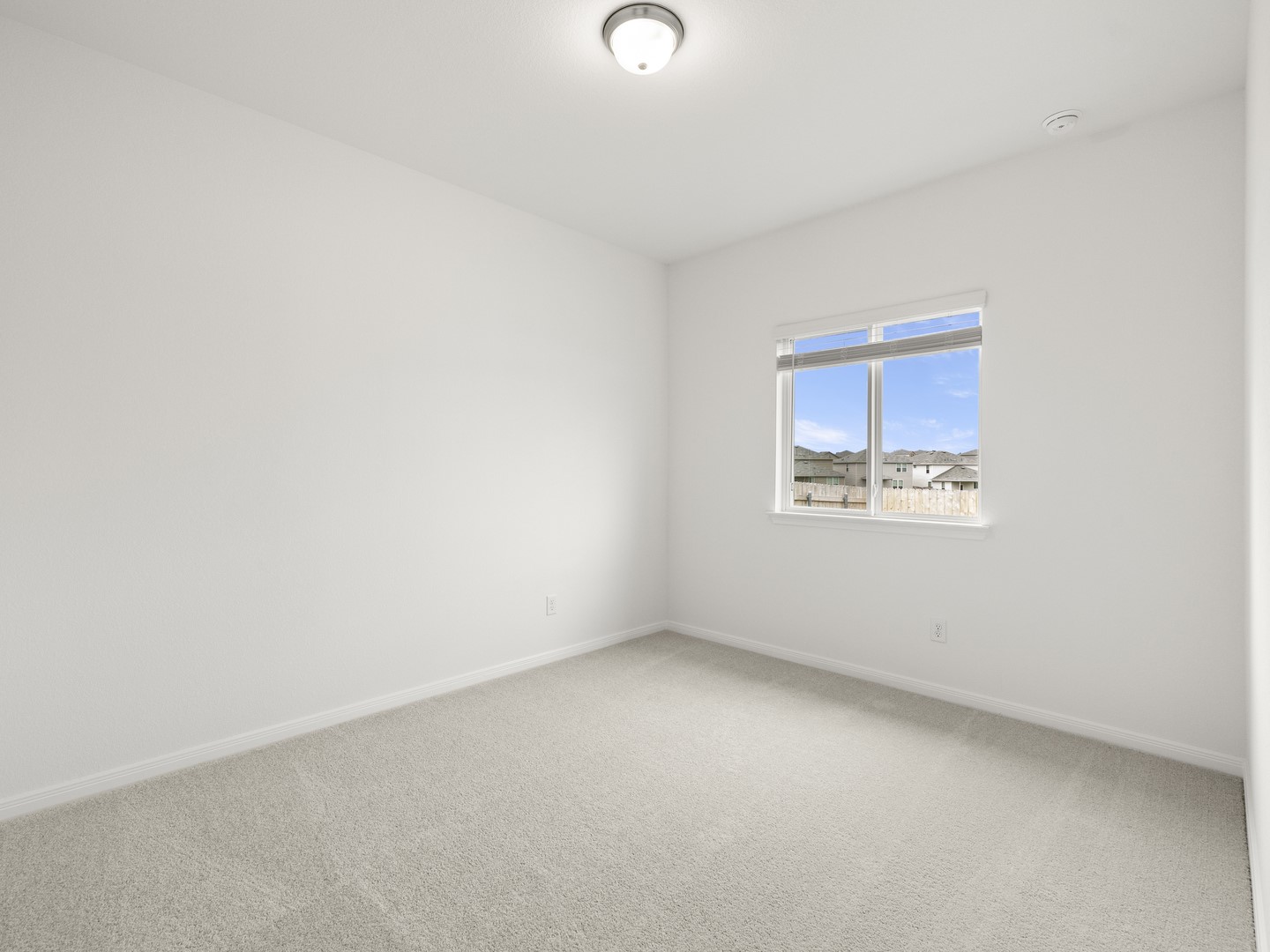 513 Yellow Ribbon Trail Jarrell, TX 76537 - Photo 12 of 23 An airy bedroom with a soft carpet, bathed in light from a large window.