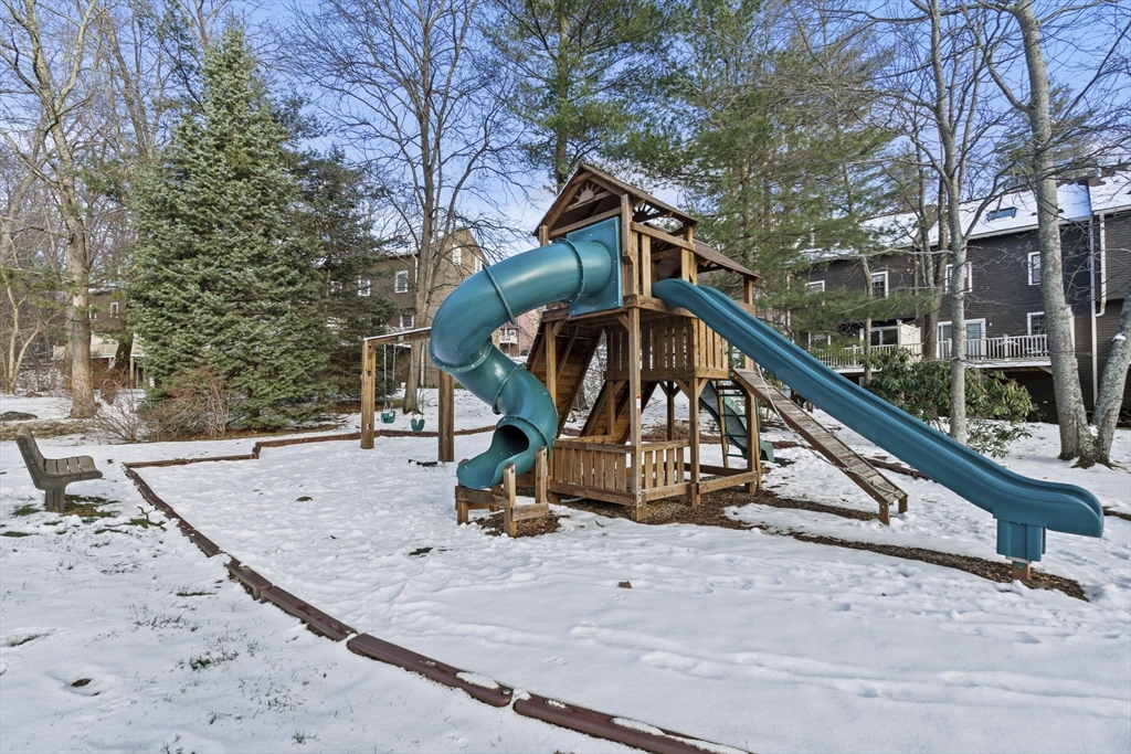 4 Apple Ridge Road, Unit 6 Maynard, MA 01754 - Photo 35 of 40 a house with trees in the background