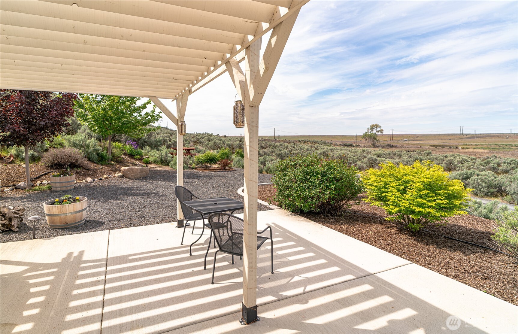 11975 Northeast Neppel Road Moses Lake, WA 98837 - Photo 14 of 33 a view of a patio with chairs and table