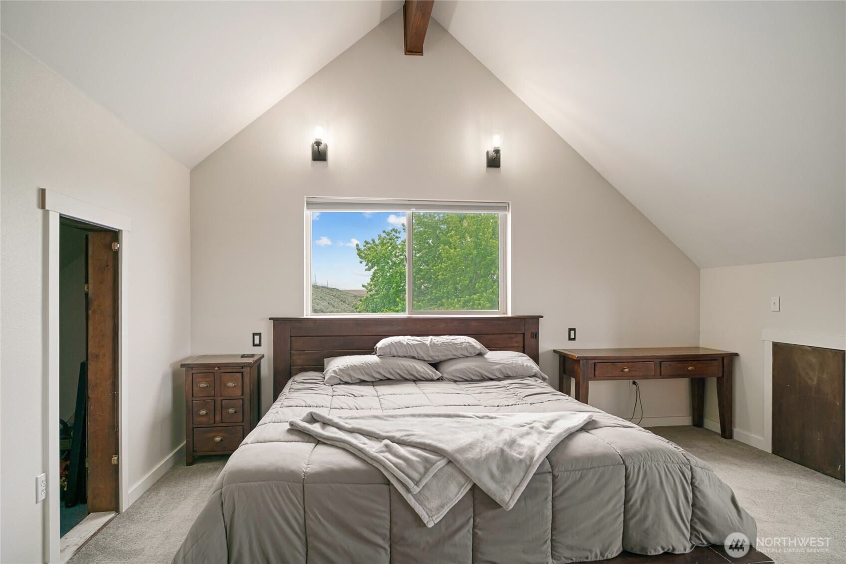 11975 Northeast Neppel Road Moses Lake, WA 98837 - Photo 23 of 33 a bedroom with a bed and a window