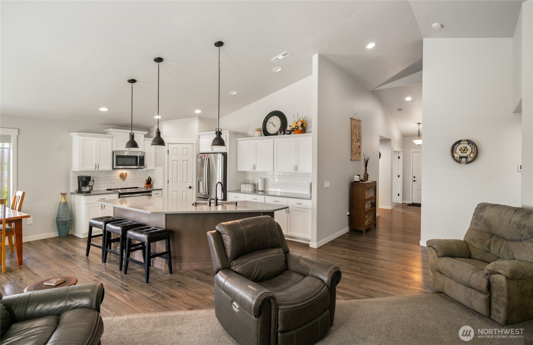 11975 Northeast Neppel Road Moses Lake, WA 98837 - Photo 6 of 33 a living room with furniture kitchen view and a chandelier