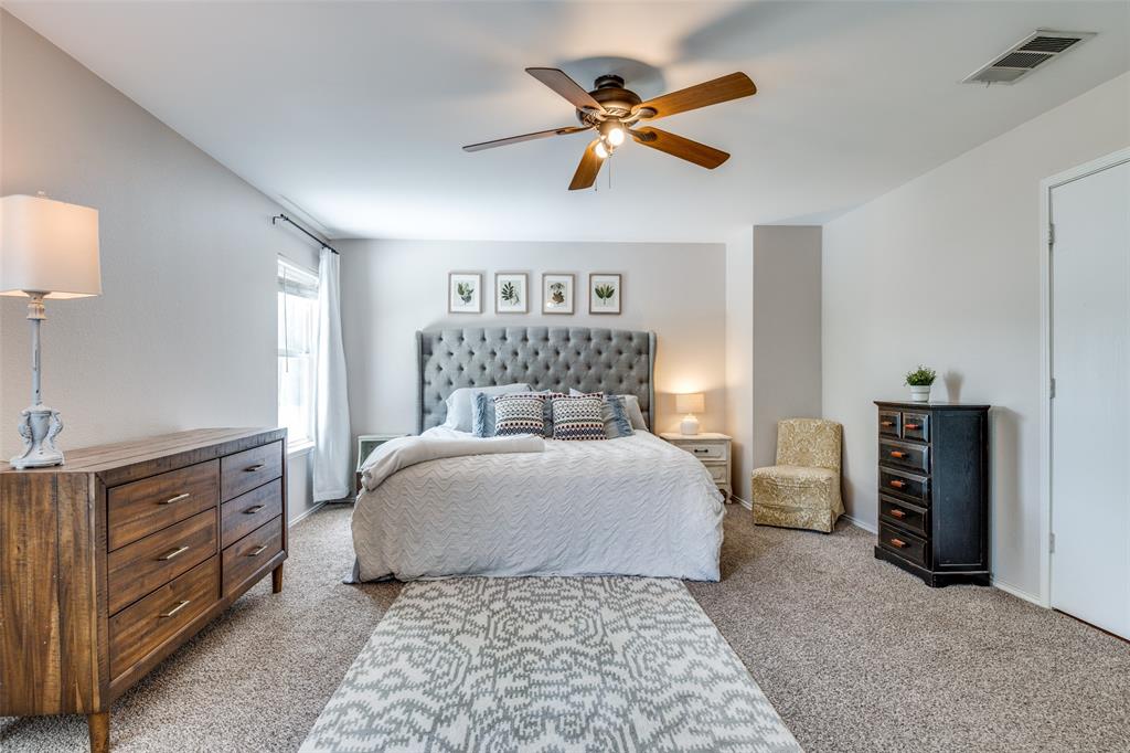 4018 Cedar Elm Lane Dallas, TX 75212 - Photo 12 of 22 a bedroom with a bed and a chandelier