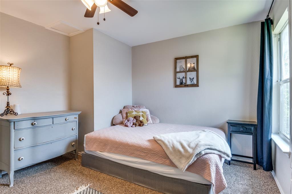4018 Cedar Elm Lane Dallas, TX 75212 - Photo 16 of 22 a bedroom with a bed and a chandelier fan