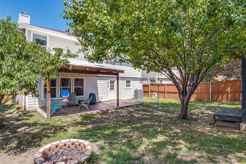 4018 Cedar Elm Lane Dallas, TX 75212 - Photo 21 of 22 a view of a house with backyard chairs and a tree