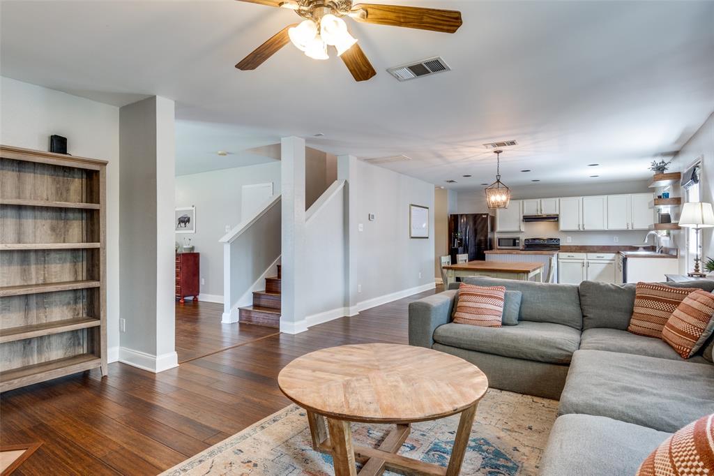 4018 Cedar Elm Lane Dallas, TX 75212 - Photo 5 of 22 a living room with furniture kitchen view and a wooden floor