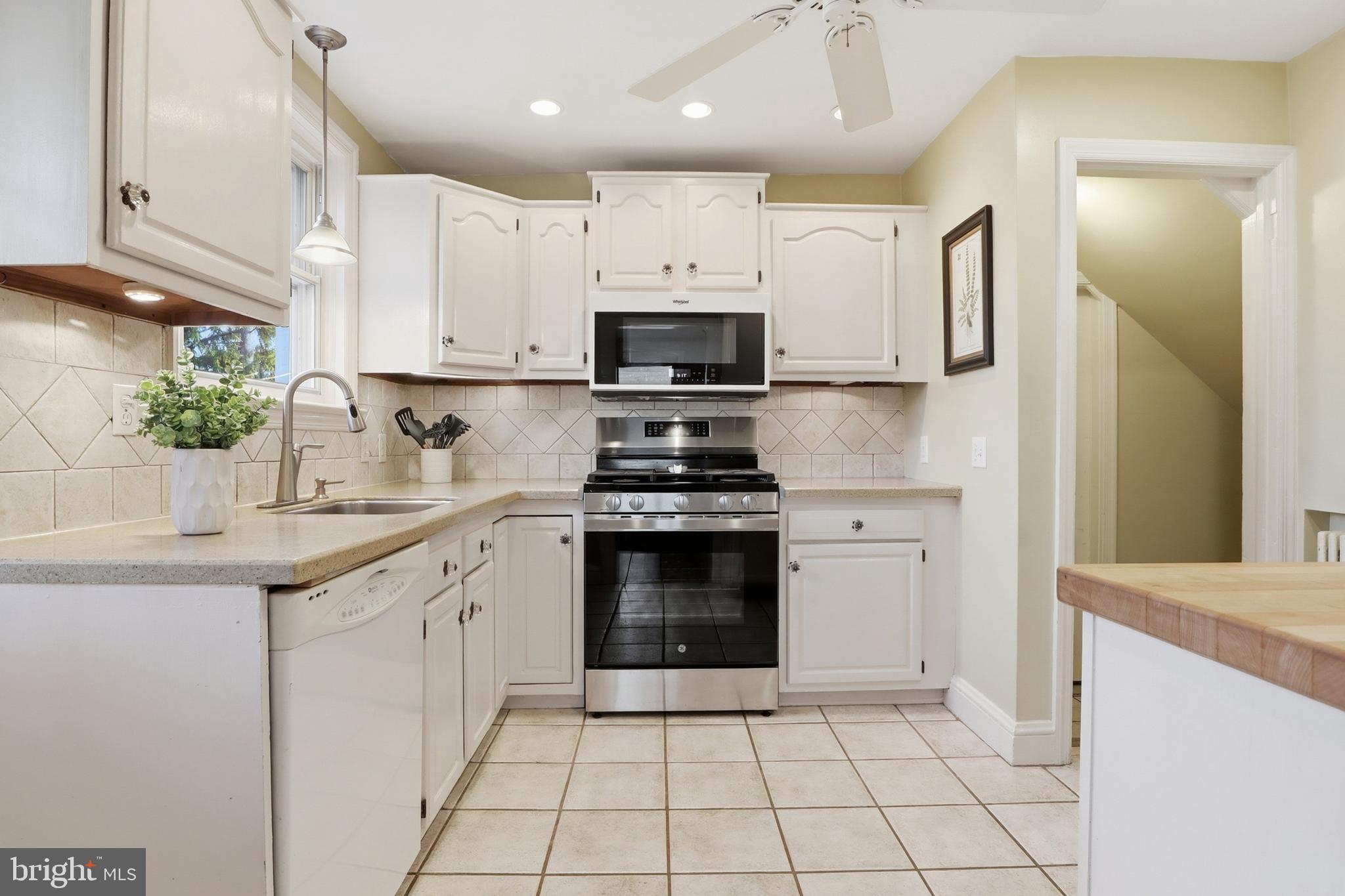 357 Old Garden Lane York, PA 17403 - Photo 11 of 62 a kitchen with a sink stove and cabinets