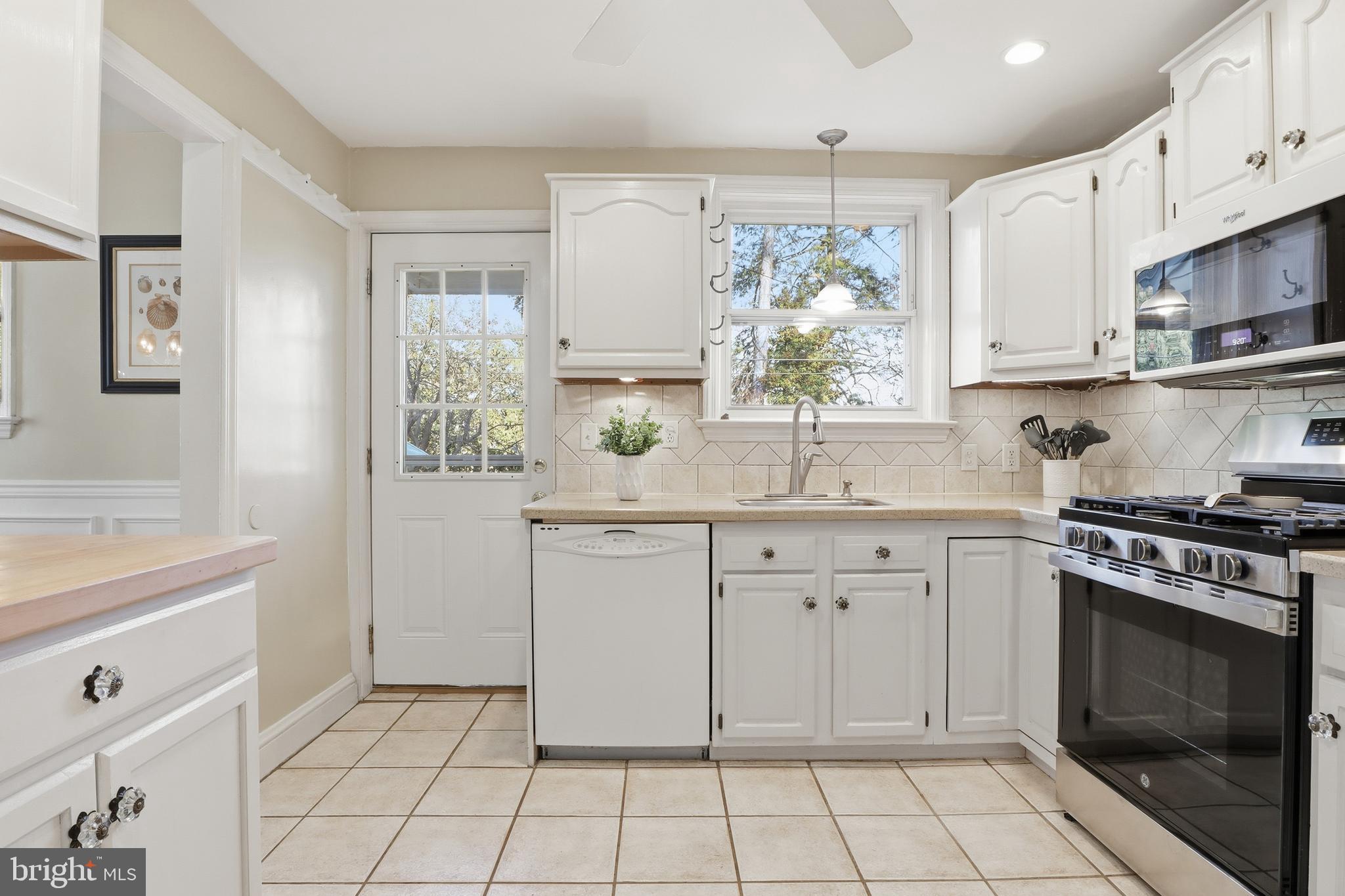 357 Old Garden Lane York, PA 17403 - Photo 12 of 62 a kitchen with white cabinets and appliances