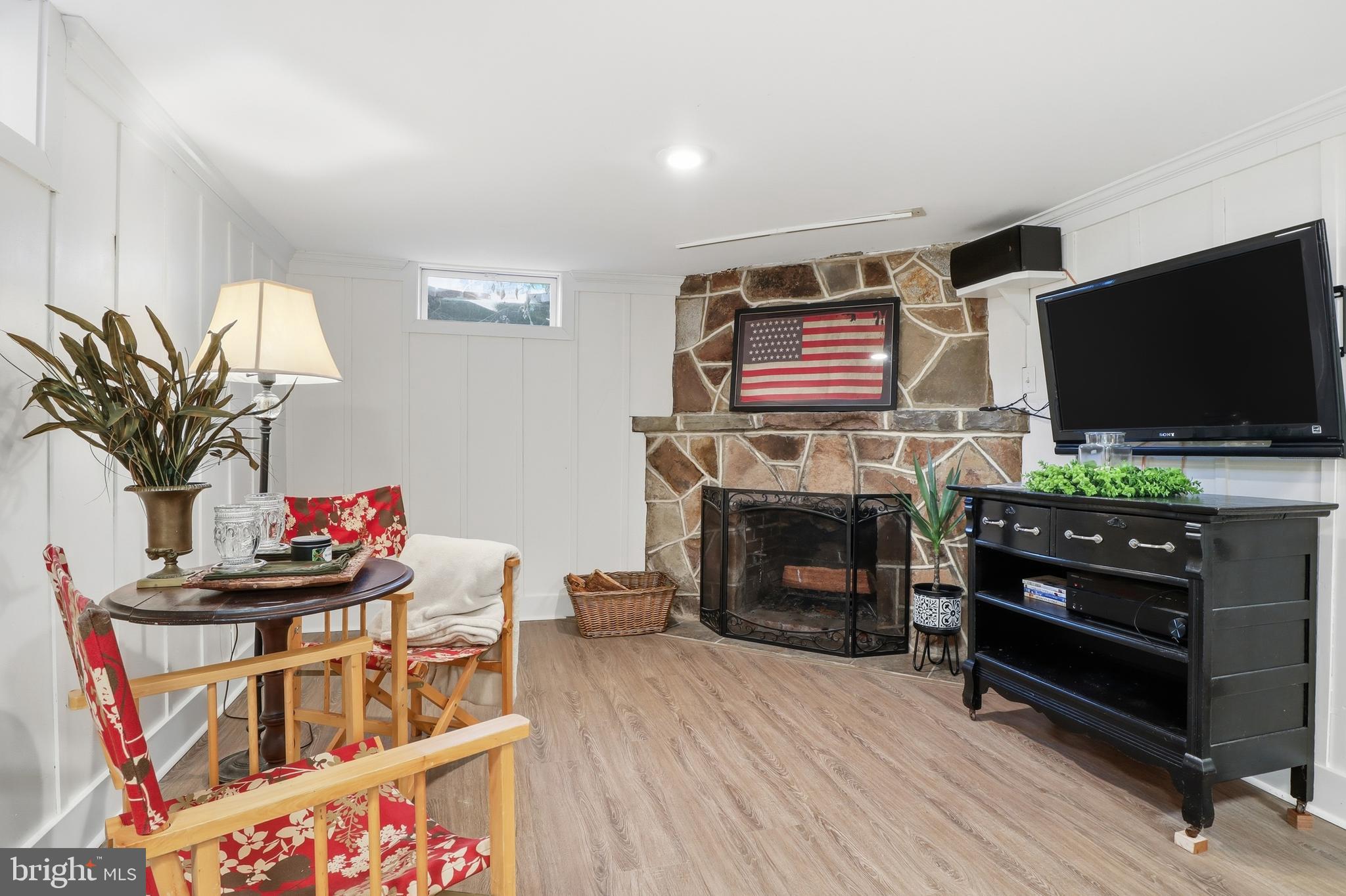 357 Old Garden Lane York, PA 17403 - Photo 33 of 62 a living room with furniture a flat screen tv and a fireplace