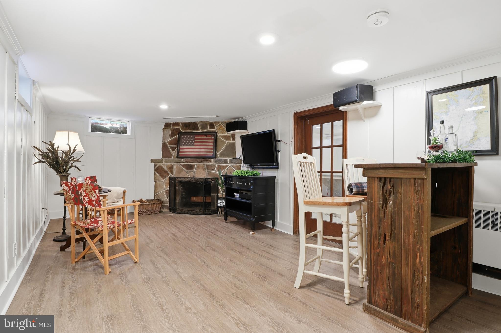 357 Old Garden Lane York, PA 17403 - Photo 34 of 62 a living room with furniture a dining table and a flat screen tv