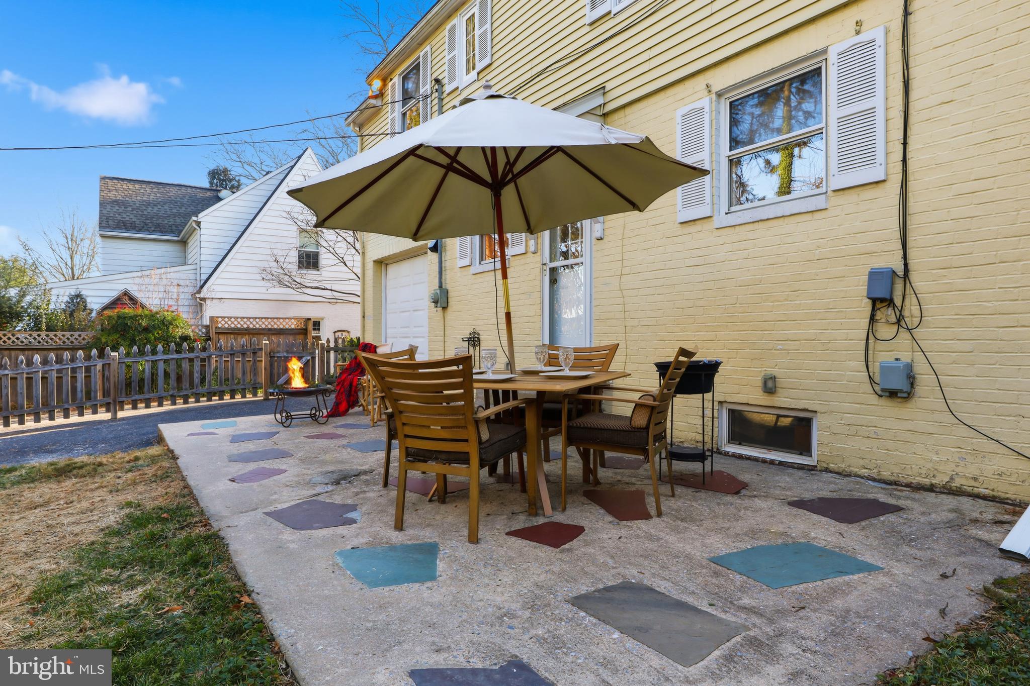 357 Old Garden Lane York, PA 17403 - Photo 40 of 62 a view of a roof deck with table and chairs under an umbrella