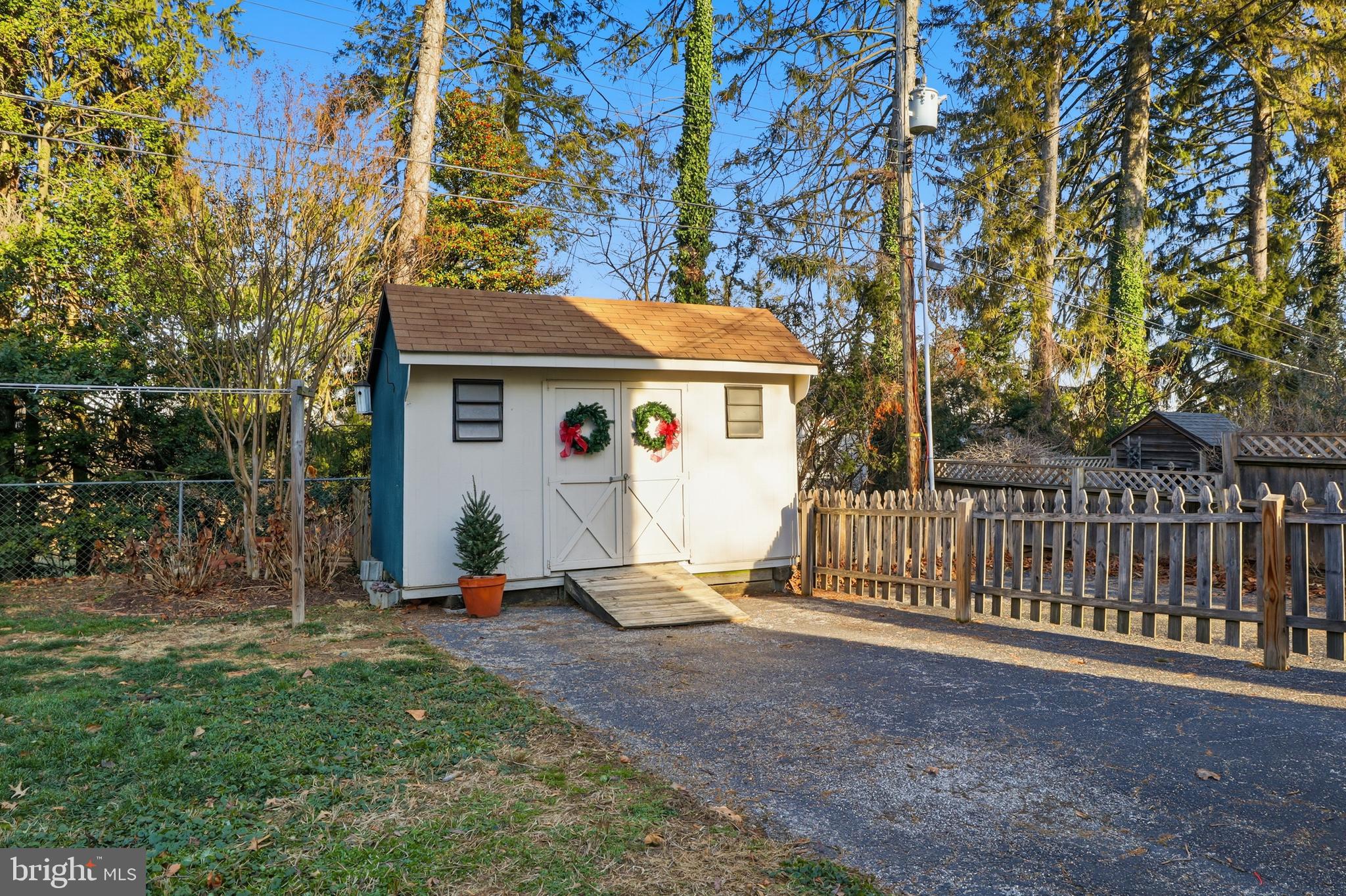 357 Old Garden Lane York, PA 17403 - Photo 42 of 62 a view of backyard with wooden fence and a large tree