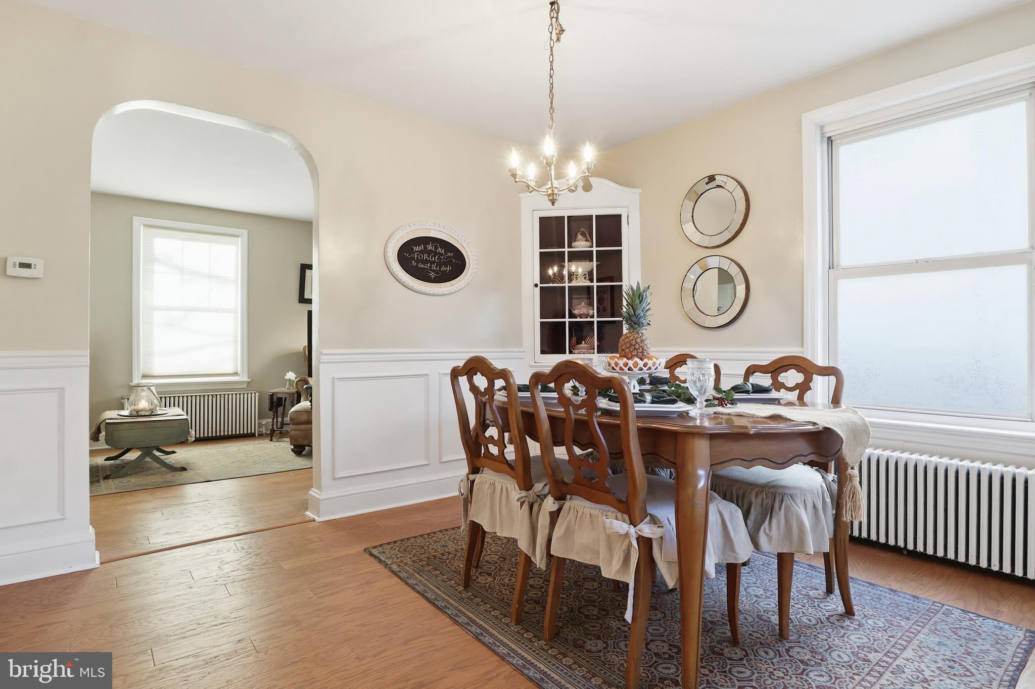 357 Old Garden Lane York, PA 17403 - Photo 9 of 62 a view of a dining room and livingroom with furniture wooden floor and a rug