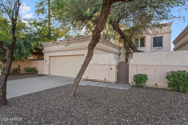 a view of a house with a tree
