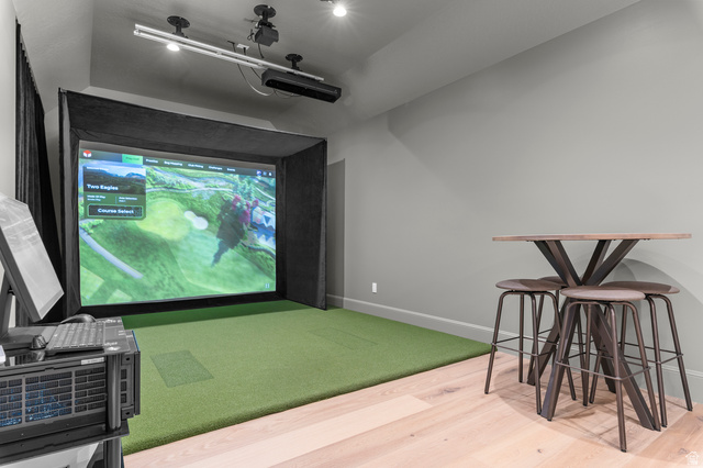 2192 East Outlaw Road Kamas, UT 84036 - Photo 9 of 80 Golf simulator with a large projection screen, dedicated turf flooring, overhead projector, and wood-finish flooring