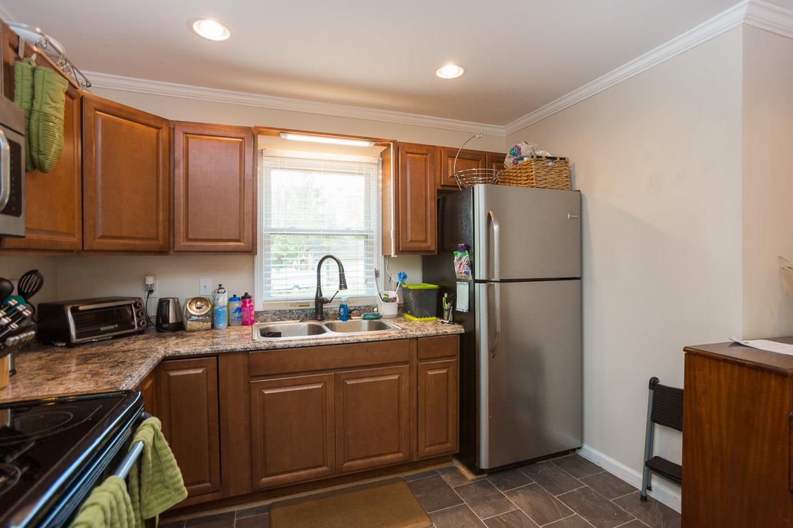 3501 Academy Road Portland, TN 37148 - Photo 18 of 22 a kitchen with stainless steel appliances granite countertop a refrigerator sink and stove