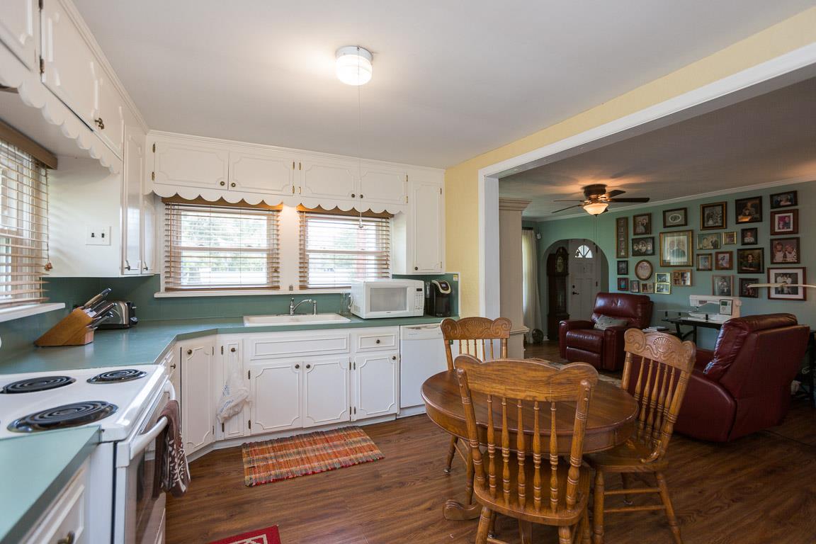 3501 Academy Road Portland, TN 37148 - Photo 10 of 22 a kitchen with a table chairs stove and cabinets