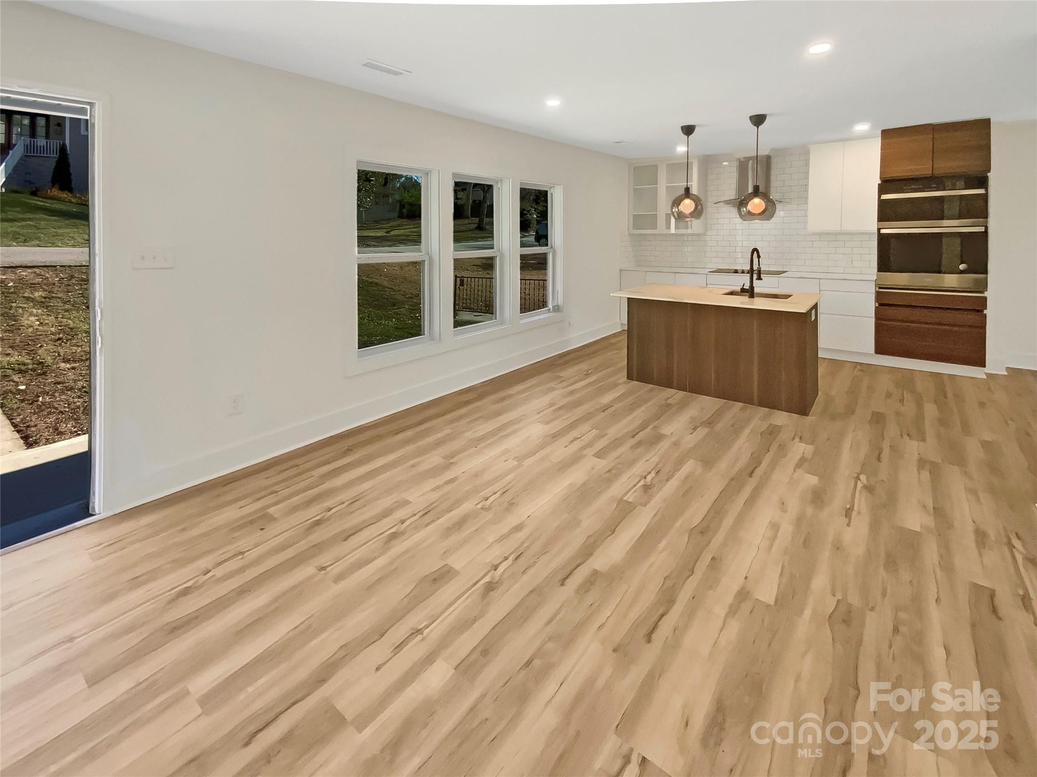 4914 Valley Stream Road Charlotte, NC 28209 - Photo 3 of 28 a view of kitchen and kitchen with wooden floor