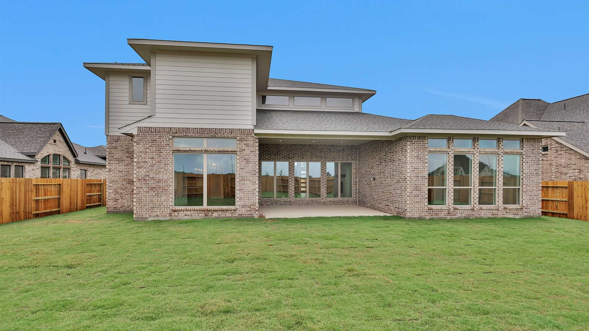 19011 Autumn Hazelnut Lane Manvel, TX 77578 - Photo 19 of 23 a big house with a big yard and large trees