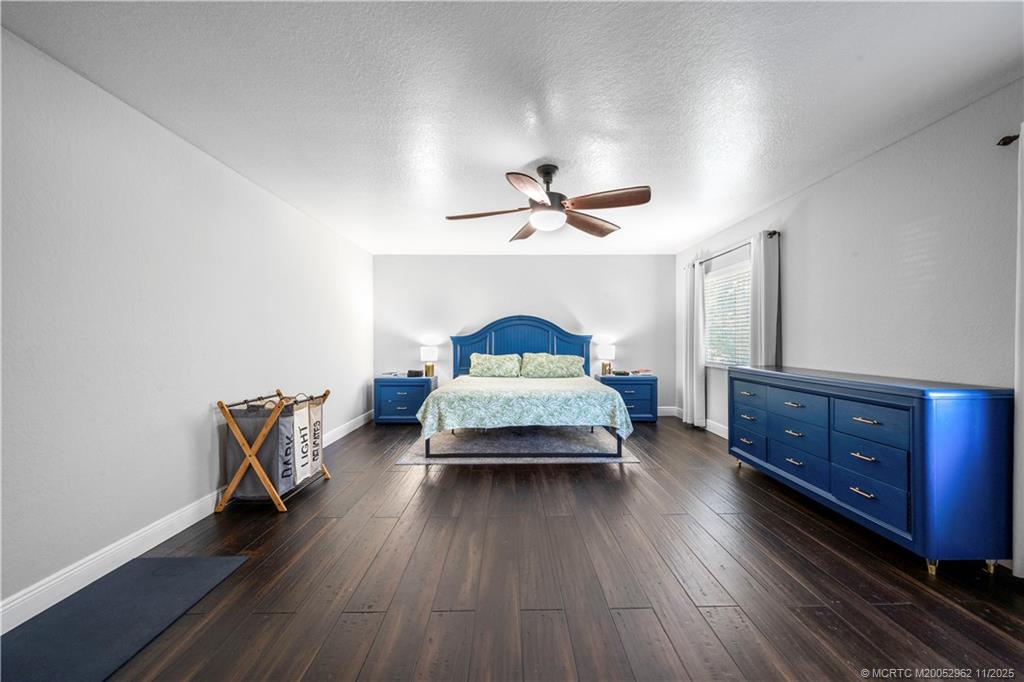 5532 Southeast Graham Drive Stuart, FL 34997 - Photo 14 of 43 a bedroom with furniture and a window